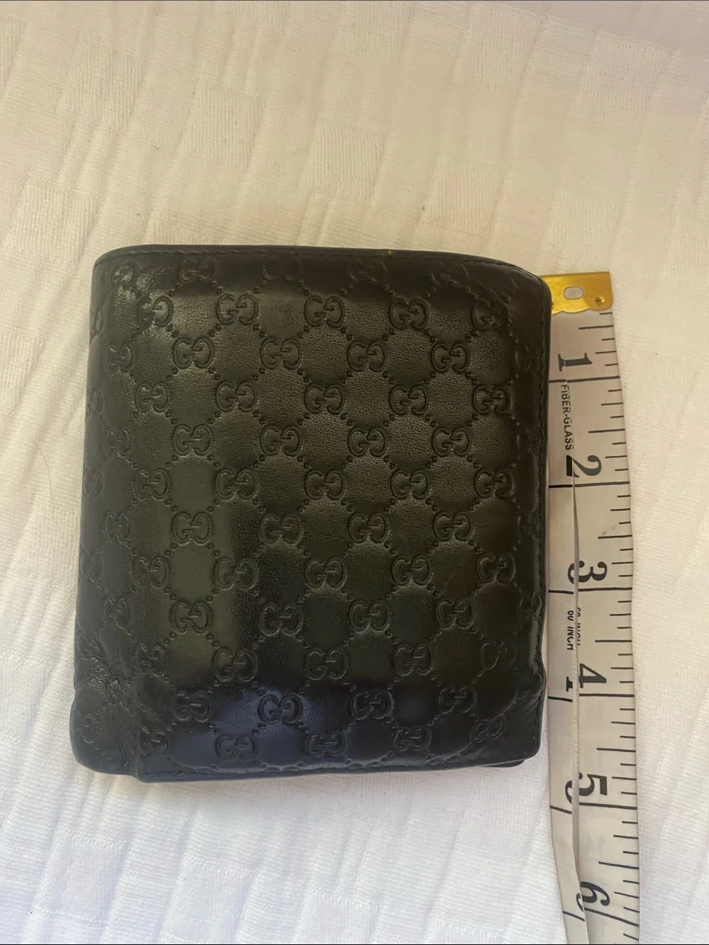 Gucci Dark Brown GG Embossed Leather Bi-Fold Wallet